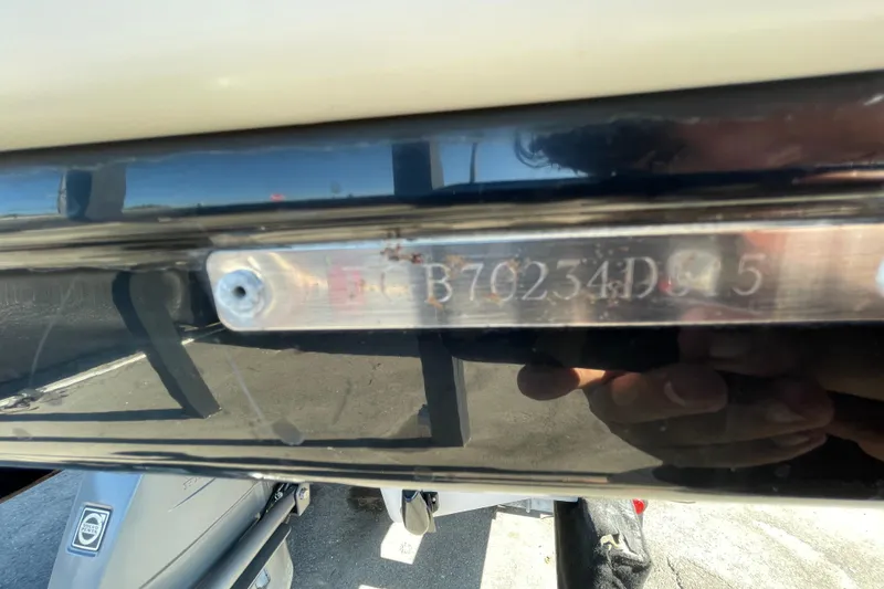 Slide: The Image of Close-up of a 2015 Chaparral 246 boat's identification number plate. - 79
