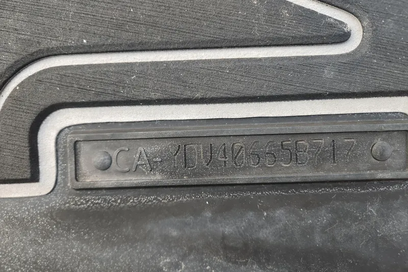 Slide: The Image of 2017 Sea-Doo GTI SE 130 hull identification number on black surface. - 15