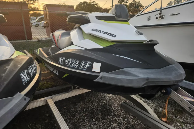 Slide: The Image of 2017 Sea-Doo GTI SE 130 jet ski parked on a trailer at sunset. - 4