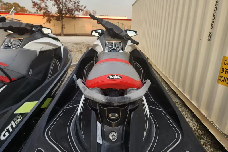 Slide: The Image of 2017 Sea-Doo GTI SE 130 jet ski parked beside a container. - 6