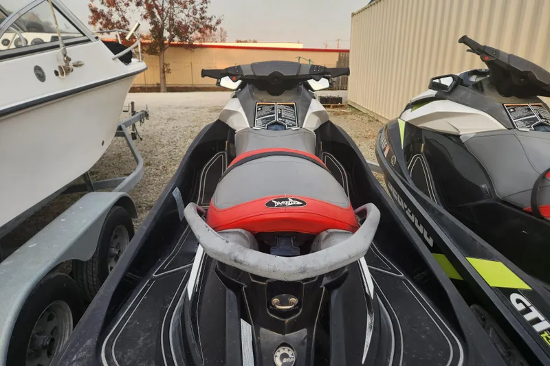 Slide: The Image of 2017 Sea-Doo GTI SE 130 jet ski parked beside a boat. - 7