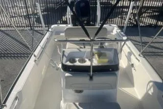 Slide: The Image of 2023 Boston Whaler 170 Montauk boat interior with console and seating. - 10