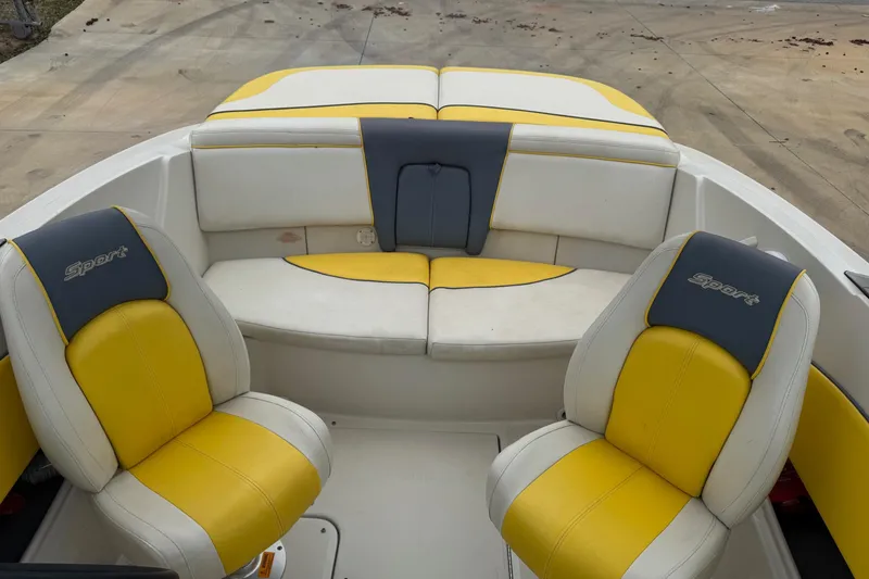 Slide: The Image of 2006 Sea Ray 195 Sport boat interior with yellow and white seating. - 3
