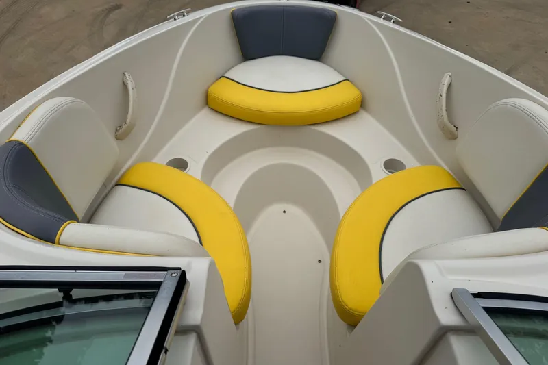 Slide: The Image of Interior of 2006 Sea Ray 195 Sport boat with yellow and gray seating. - 6