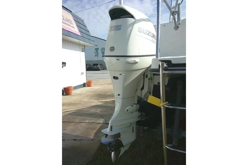 Slide: The Image of Suzuki 115 outboard motor on 2003 Glacier Bay 2240 Dual Console boat. - 11
