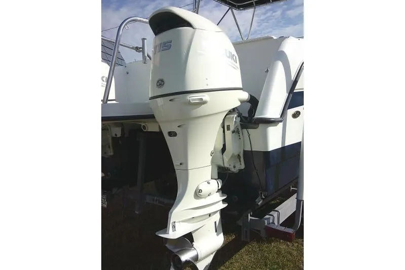 Slide: The Image of 2003 Glacier Bay 2240 Dual Console boat with outboard motor, parked on trailer. - 12