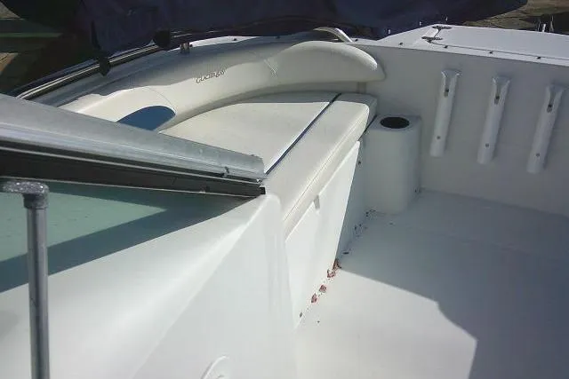 Slide: The Image of 2003 Glacier Bay 2240 Dual Console boat interior with seating and rod holders. - 15