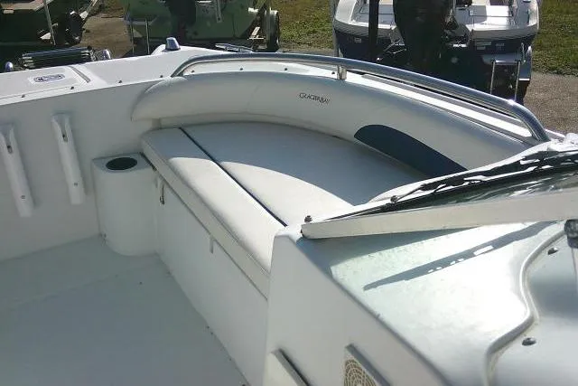 Slide: The Image of 2003 Glacier Bay 2240 Dual Console boat interior with cushioned seating. - 16