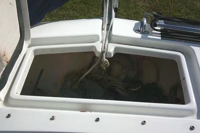Slide: The Image of Open storage compartment on 2003 Glacier Bay 2240 Dual Console boat with ropes inside. - 19