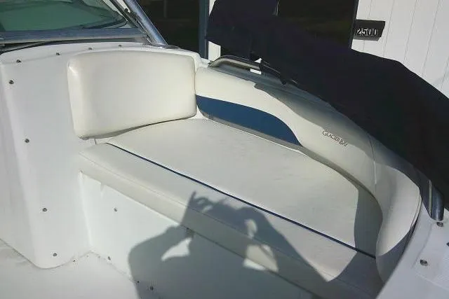 Slide: The Image of 2003 Glacier Bay 2240 Dual Console boat seating area with white upholstery. - 21
