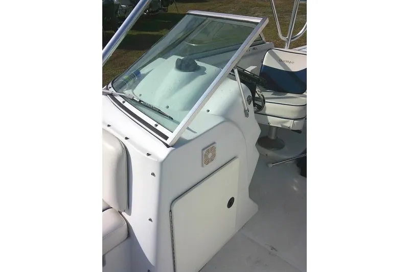 Slide: The Image of 2003 Glacier Bay 2240 Dual Console boat interior with steering wheel and seating. - 24