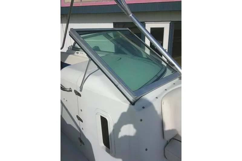 Slide: The Image of 2003 Glacier Bay 2240 Dual Console boat windshield and console detail. - 25