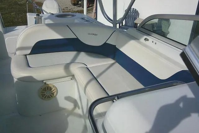 Slide: The Image of 2003 Glacier Bay 2240 Dual Console boat interior with cushioned seating and speaker. - 27