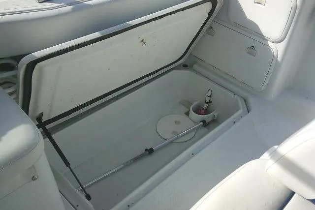Slide: The Image of Open storage compartment in 2003 Glacier Bay 2240 Dual Console boat interior. - 28