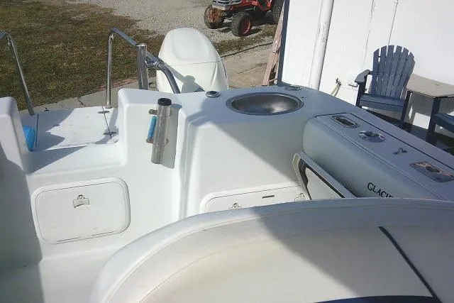 Slide: The Image of 2003 Glacier Bay 2240 Dual Console boat interior with seating and storage compartments. - 31
