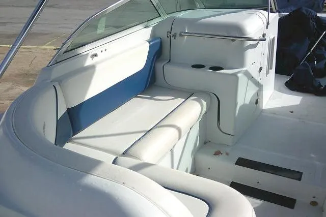 Slide: The Image of 2003 Glacier Bay 2240 Dual Console boat interior with white and blue seating. - 33