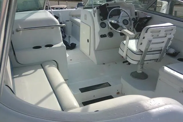 Slide: The Image of 2003 Glacier Bay 2240 Dual Console boat interior with seating and steering wheel. - 37
