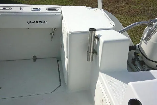 Slide: The Image of 2003 Glacier Bay 2240 Dual Console boat interior with rod holder and storage. - 39