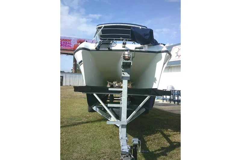 Slide: The Image of 2003 Glacier Bay 2240 Dual Console boat on trailer, viewed from the front. - 4