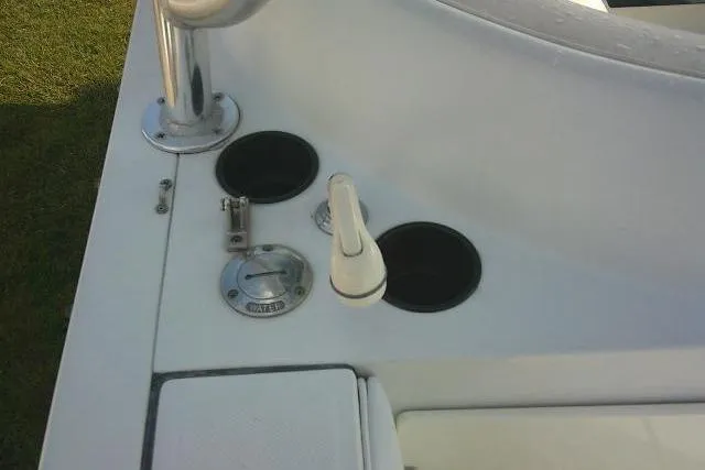 Slide: The Image of 2003 Glacier Bay 2240 Dual Console boat deck with cup holders and water access. - 41