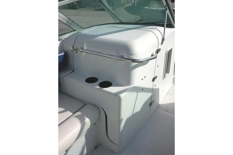 Slide: The Image of 2003 Glacier Bay 2240 Dual Console boat interior with cup holders and seating. - 42