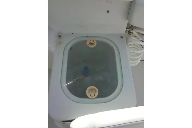 Slide: The Image of Livewell on 2003 Glacier Bay 2240 Dual Console boat, featuring a transparent lid. - 45