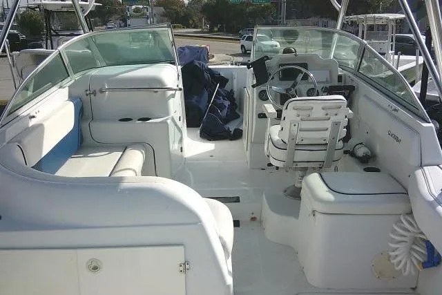 Slide: The Image of 2003 Glacier Bay 2240 Dual Console boat interior with seating and steering wheel. - 49