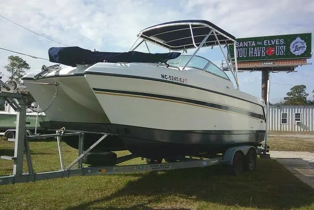 Slide: The Image of 2003 Glacier Bay 2240 Dual Console boat on trailer, parked outdoors. - 5