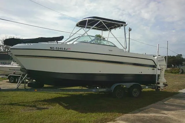Slide: The Image of 2003 Glacier Bay 2240 Dual Console boat on trailer, parked outdoors. - 6