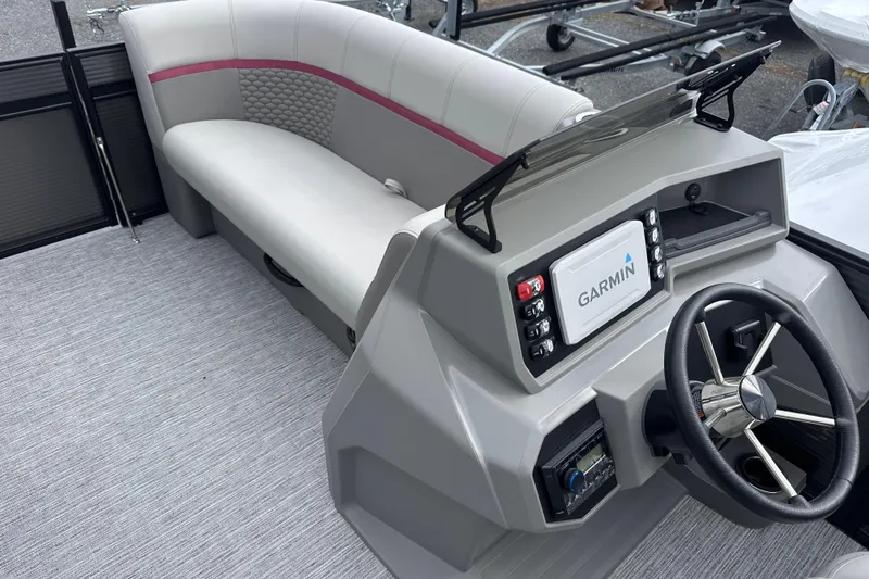 Slide: The Image of 2024 Qwest 8518 RLS boat interior with Garmin navigation system and stylish seating. - 6