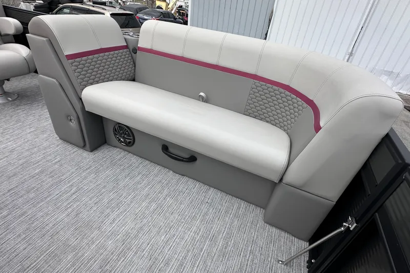 Slide: The Image of 2024 Qwest 8518 RLS boat interior with gray seating and maroon accents. - 8