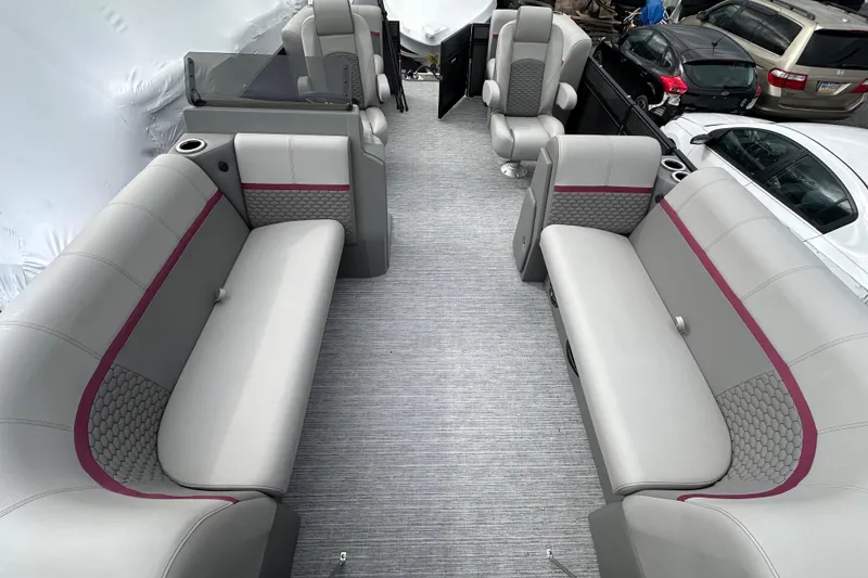 Slide: The Image of Luxurious interior of 2024 Qwest 8518 RLS pontoon boat with plush seating and modern design. - 9