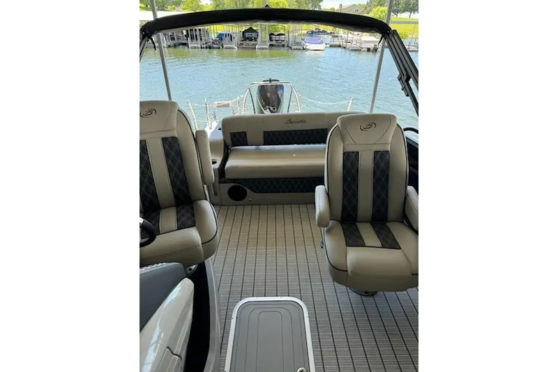 Slide: The Image of 2022 Barletta Lusso 23UC boat interior with luxurious seating and lake view. - 8