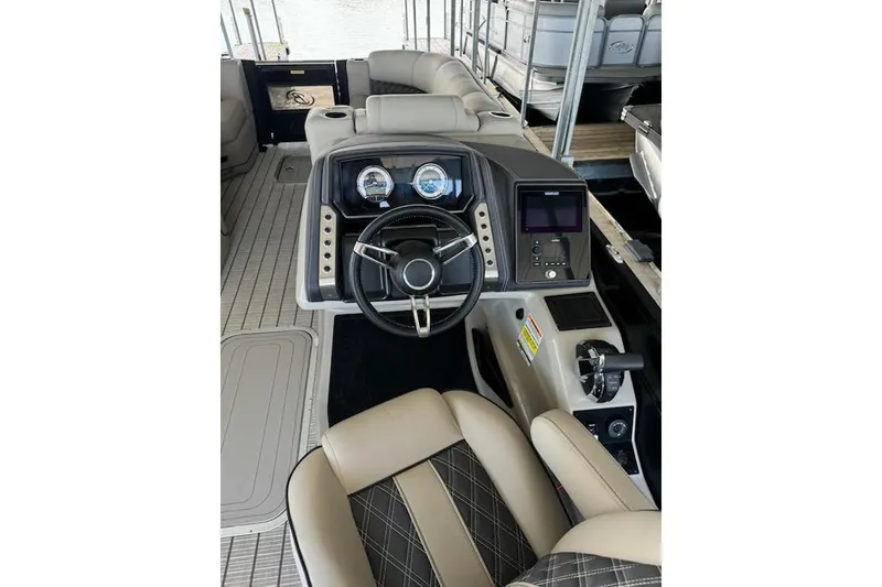Slide: The Image of Interior view of 2022 Barletta Lusso 23UC boat cockpit with steering wheel and controls. - 9