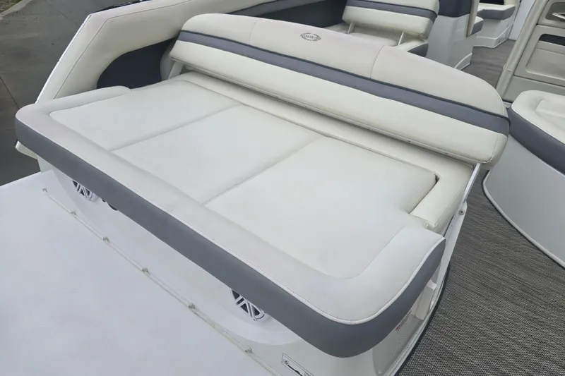 Slide: The Image of Luxury seating on 2016 Marker One ML4 boat, featuring white and gray upholstery. - 11