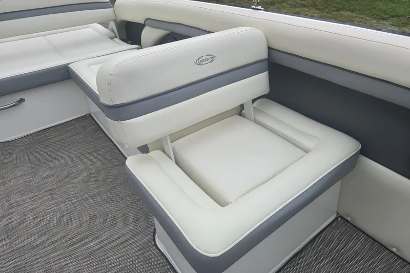 Slide: The Image of Luxurious seating on 2016 Marker One ML4 boat, featuring elegant white and gray upholstery. - 14
