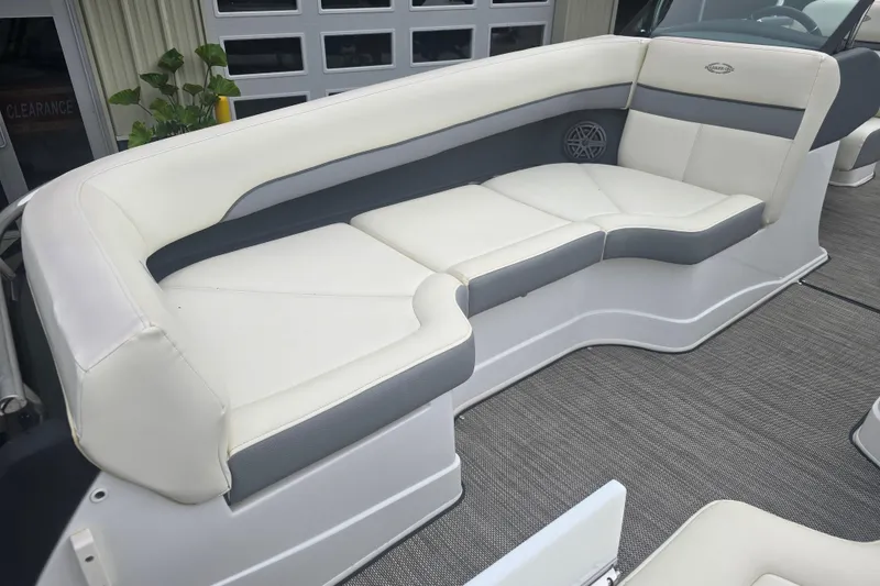 Slide: The Image of Luxurious seating on 2016 Marker One ML4 boat, featuring white and gray upholstery. - 20