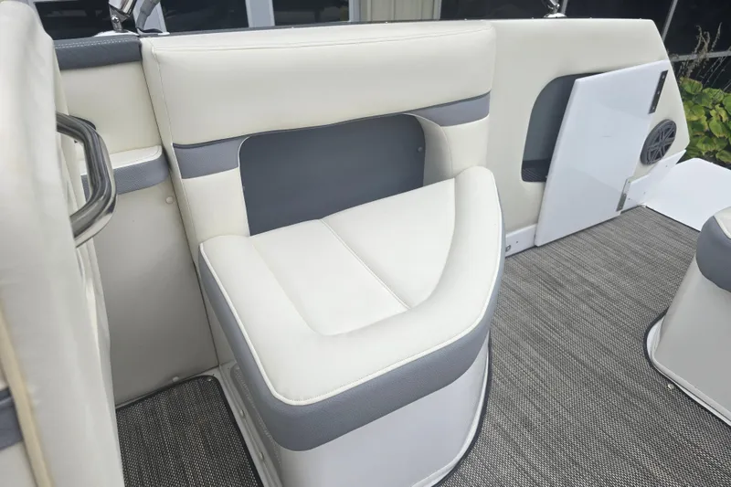 Slide: The Image of Luxurious seating on 2016 Marker One ML4 boat with gray and white upholstery. - 9