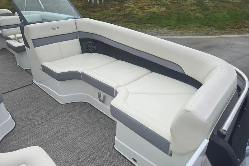 Slide: The Image of Luxurious seating on a 2016 Marker One ML4 boat, featuring white and gray upholstery. - 10