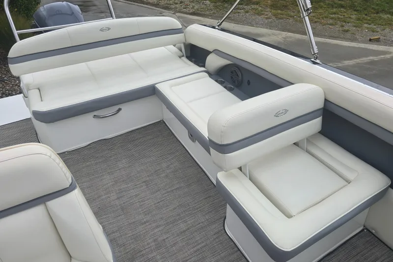 Slide: The Image of Luxurious seating on a 2016 Marker One ML4 boat, featuring plush white upholstery. - 19