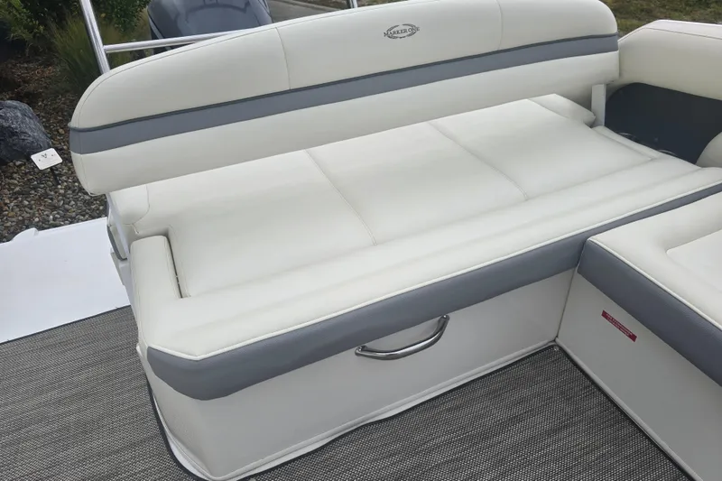 Slide: The Image of White and gray seating on 2016 Marker One ML4 boat, featuring sleek design and comfortable upholstery. - 21