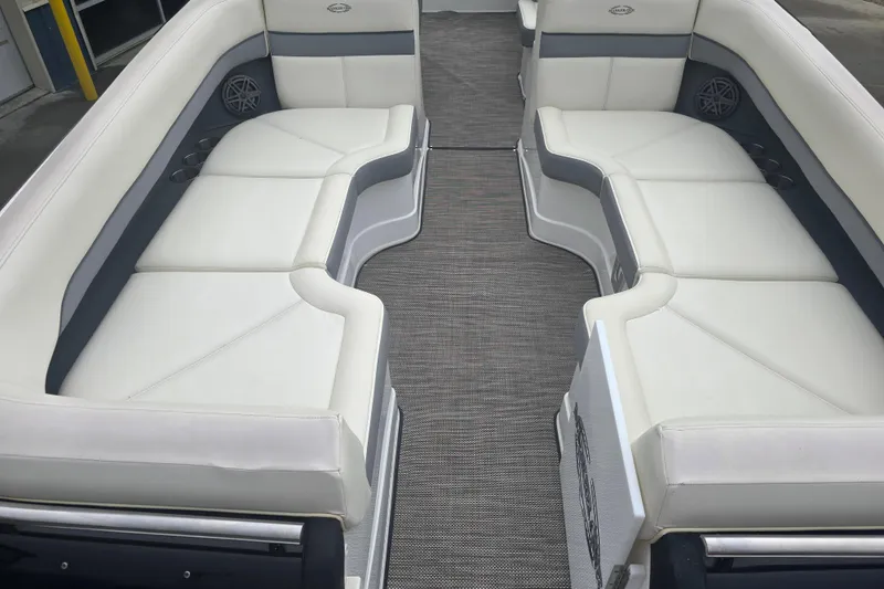 Slide: The Image of Luxurious seating on a 2016 Marker One ML4 boat, featuring white and gray upholstery. - 8