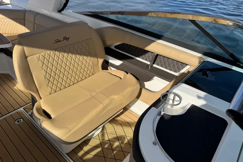 Slide: The Image of 2026 Sea Ray SLX 310 boat interior with tan leather seating and elegant design. - 20