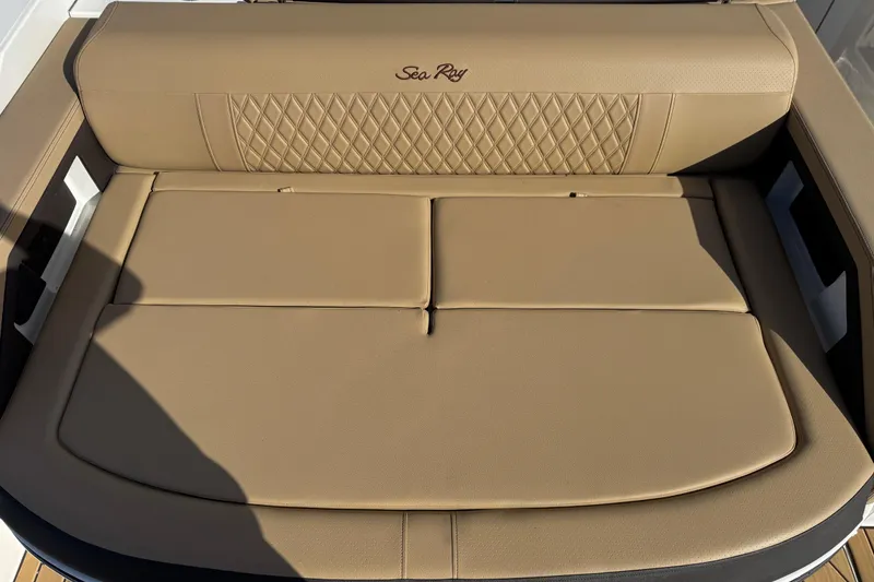 Slide: The Image of Luxurious tan seating on 2026 Sea Ray SLX 310 boat, featuring diamond stitching. - 32
