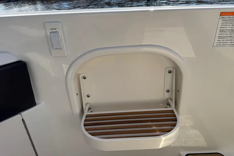 Slide: The Image of Hatch and step detail on 2026 Sea Ray SLX 310 boat. - 37