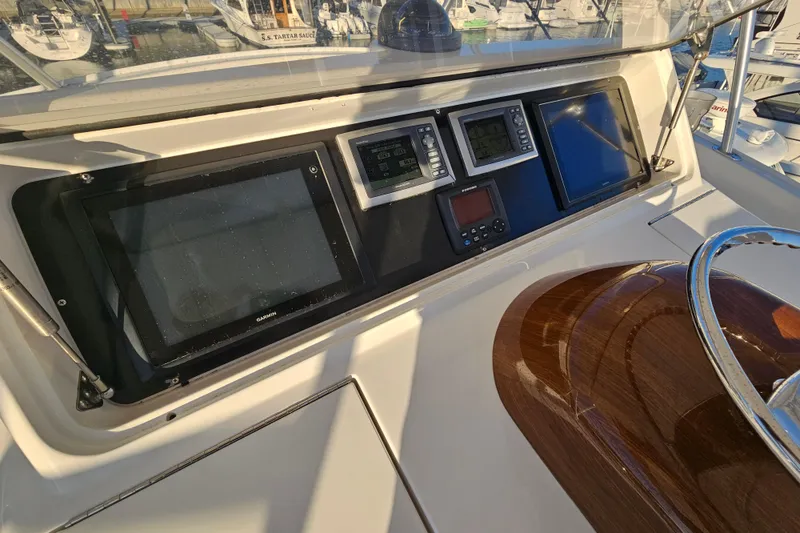 Slide: The Image of Control panel of 2013 Viking 42 Convertible yacht with navigation equipment. - 25
