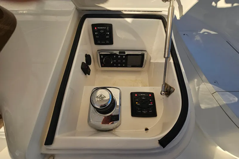 Slide: The Image of Control panel of 2013 Viking 42 Convertible yacht with navigation and operation controls. - 27