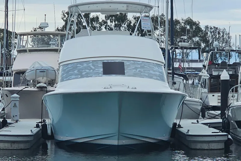 Slide: The Image of 2013 Viking 42 Convertible yacht docked at marina, front view. - 3