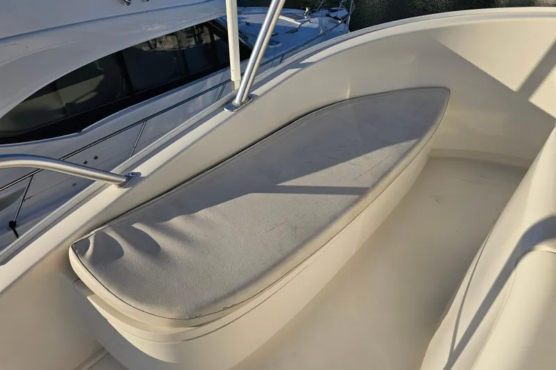 Slide: The Image of Cushioned seating area on 2013 Viking 42 Convertible yacht deck. - 33