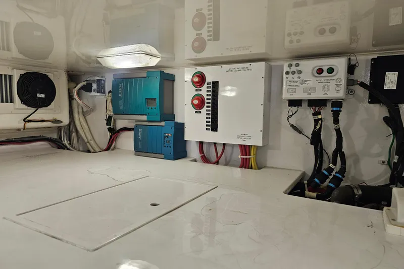 Slide: The Image of Engine room of 2013 Viking 42 Convertible with electrical panels and wiring. - 54